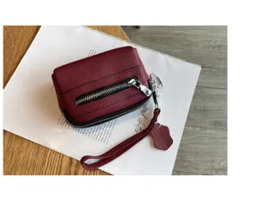 Women genuine leather mini coin purse with double zippers, compact wrist bag and card holder for daily use.