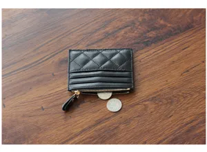 Black leather quilted card holder mini zipper wallet chic coin purse for women daily use.