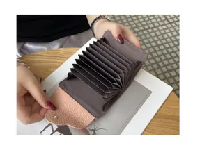 Genuine leather accordion card holder with multi slots for daily use and easy organization.