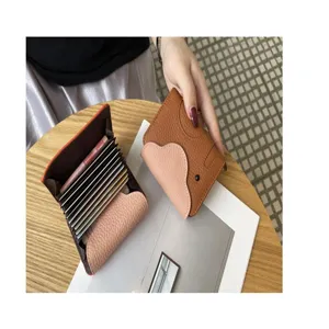Detailed view of genuine leather elephant card holder with multiple card slots and bi-fold design.