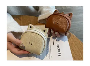 Compact genuine leather coin purse with cute animal ears design, portable mini wallet for women.