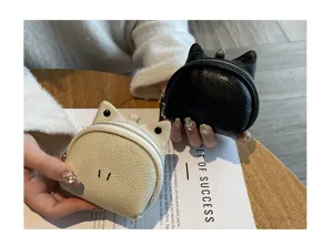 Detailed view of the cute cat ear leather coin purse, showing fine texture and compact design.