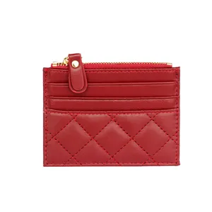 Red leather card holder with chic quilted design, slim zip coin purse and multiple card slots.