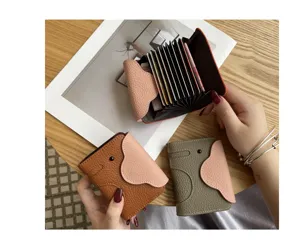 Genuine leather elephant card holder with multiple accordion slots for daily use.
