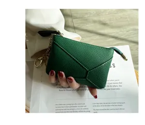 Dark green genuine leather coin purse and key bag with zipper and metal chain for women style.