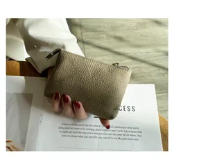 Compact genuine leather coin purse for women, soft cowhide zipper pouch with key ring.