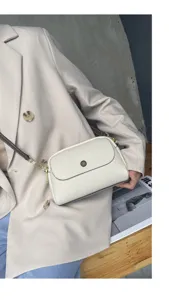 Elegant genuine leather crossbody shoulder bag for women with chic design and stylish hardware.