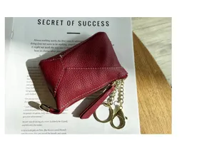 Burgundy genuine leather coin purse with contrast stitching, gold zipper and key rings.