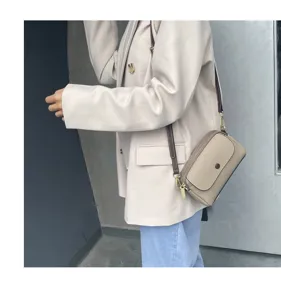 Genuine leather women shoulder crossbody bag, stylish daily handbag with adjustable brown strap.