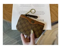 Mini brown monogram coin purse with keychain, cute short zipper wallet for women.