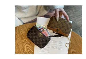 Stylish women mini coin purse with monogram pattern, short zipper card holder and keychain.