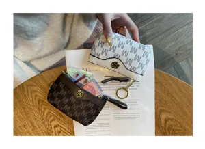 Mini coin purse and card holder for women, cute short zipper wallet with stylish letter print.