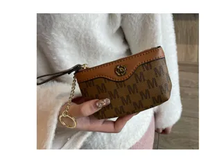 Mini brown monogram coin purse with cute flower clasp and chain zipper for women new style.