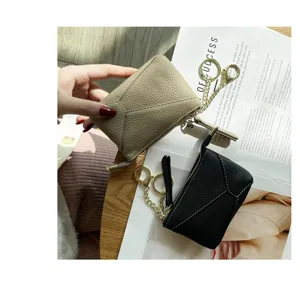 Genuine leather coin purse detail shot, soft cowhide zipper key pouch with chain hook.