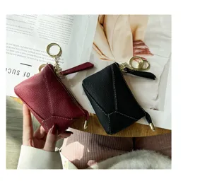Genuine leather coin purse and key case with zipper closure, soft texture and metal ring hook.