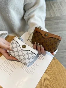 Cute mini coin purse for women, trendy monogram letter design with zipper and floral button.