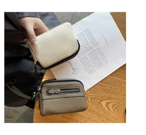 Women mini genuine leather coin purse with double zipper, compact multi-functional clutch bag.