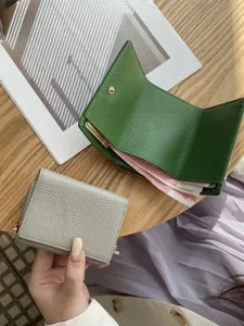Japanese style genuine leather women trifold mini wallet with multiple card slots and coin pocket.