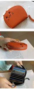 Detailed view of the cute orange cat card holder showing multi-card slots and zipper.