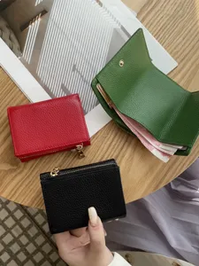 Compact genuine leather women's trifold mini wallet with coin pocket, stylish and portable.