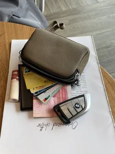 Mini genuine leather double zipper coin purse and clutch bag in elegant grey color.