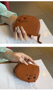 Compact brown leather cat shaped coin purse and card holder with cute animal embroidery design.