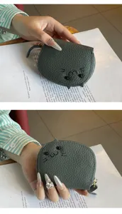 Compact cute cat design PU leather coin purse and card holder for women, portable and stylish.