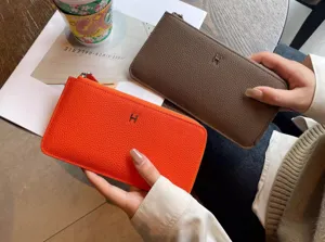 Portefeuille long femme en cuir porte-cartes design chic luxueux avec fermeture eclair.