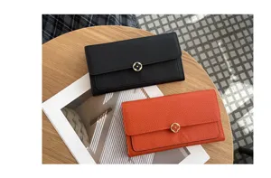 Women's genuine leather long wallet with metal flower clasp and exquisite design.