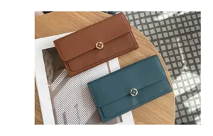 Genuine leather long wallet for women, elegant clutch purse with clover metal clasp closure.