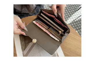 Women's genuine leather long wallet clutch bag with large capacity, card slots and phone pocket.