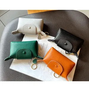 Mini leather coin purse compact keychain wallet casual cute small pouch for women daily use.