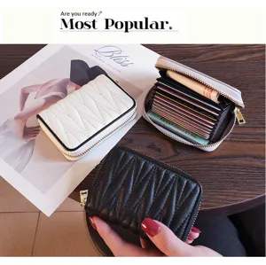 Compact leather card holder for women, slim multi-slot accordion wallet with large capacity detail.