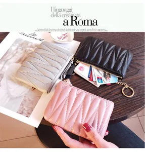 Mini quilted leather coin purse with zipper and key ring, stylish small wallet for women.