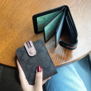 Leather driver license holder card wallet with snap closure and vintage print pattern.