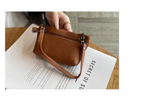 Genuine leather coin purse for women mini soft leather zipper bag with wrist strap daily use.