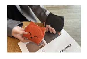 Compact leather cat card holder coin purse with zipper closure, cute portable mini wallet for women.