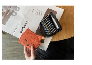 Cute cat leather card holder detail, compact multi-slot accordion wallet with secure zipper closure.