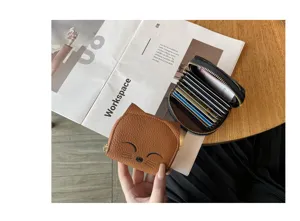 Cute cat leather card holder with multi-slot accordion design for compact daily organization.