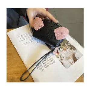 Cute mini coin purse for women, black leather pouch with pink cat ears and wrist strap.