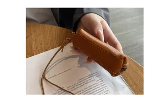 Mini genuine leather lipstick coin pouch with lanyard, vintage brown purse for women.