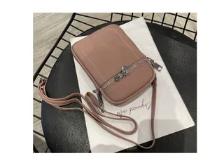 Detailed close-up view of the mini leather phone crossbody bag, showing fine zipper and texture.
