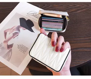 Compact genuine leather card holder for women with multi-card slots and slim design.