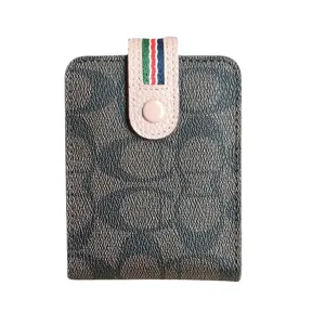 Stylish women leather driver license card holder with monogram pattern and snap button closure.