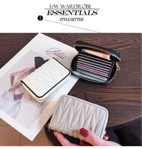 Detailed view of genuine leather card holder with multiple slots, zipper closure and slim design.