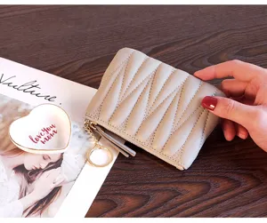 Women small mini leather coin purse short wallet with zipper and keychain in grey color.