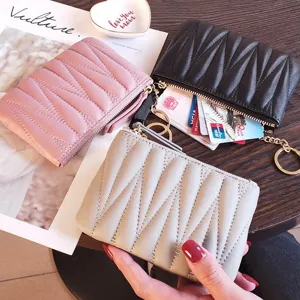 Compact genuine leather women coin purse mini thin short wallet with simple zipper closure.