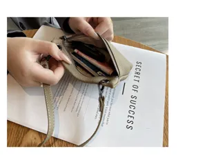 Genuine leather mini coin purse for women, soft cowhide small zipper wallet detail view.