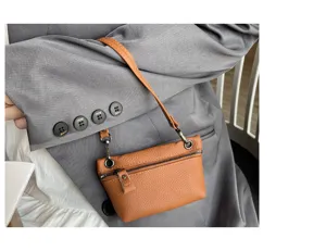 Brown leather mini coin purse women small zipper pouch top-layer cowhide fashion detail shot