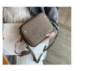 Genuine leather camera crossbody bag for women, stylish square shoulder bag with metal H lock.